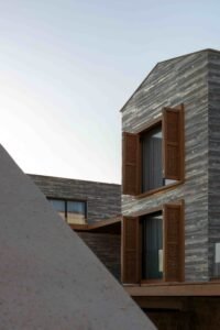 Stripped Stone Golden Gray ledge stone exterior wall on a countryside villa
