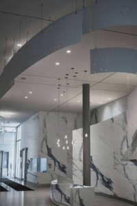 Rockface Stone Statuario Marble natural rock cladding in an art hall
