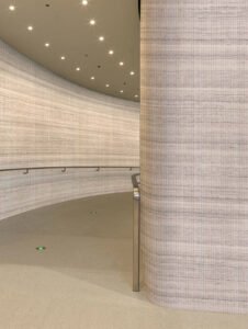 Mystic Grey lightweight stone panels in a contemporary corridor