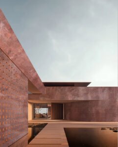 Rusty Red concrete wall panels on a contemporary commercial exhibition building exterior