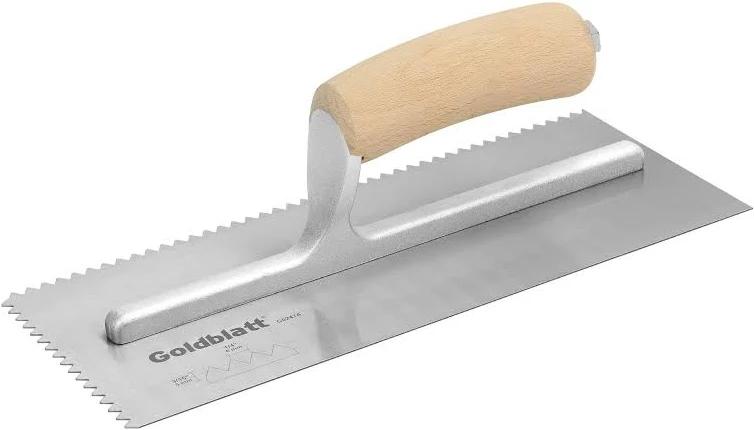 Notched trowel for flexible stone adhesive